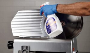 How often must a meat slicer be cleaned and sanitized: Step